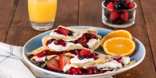 Orange Crepes with Whipped Cream and Berries